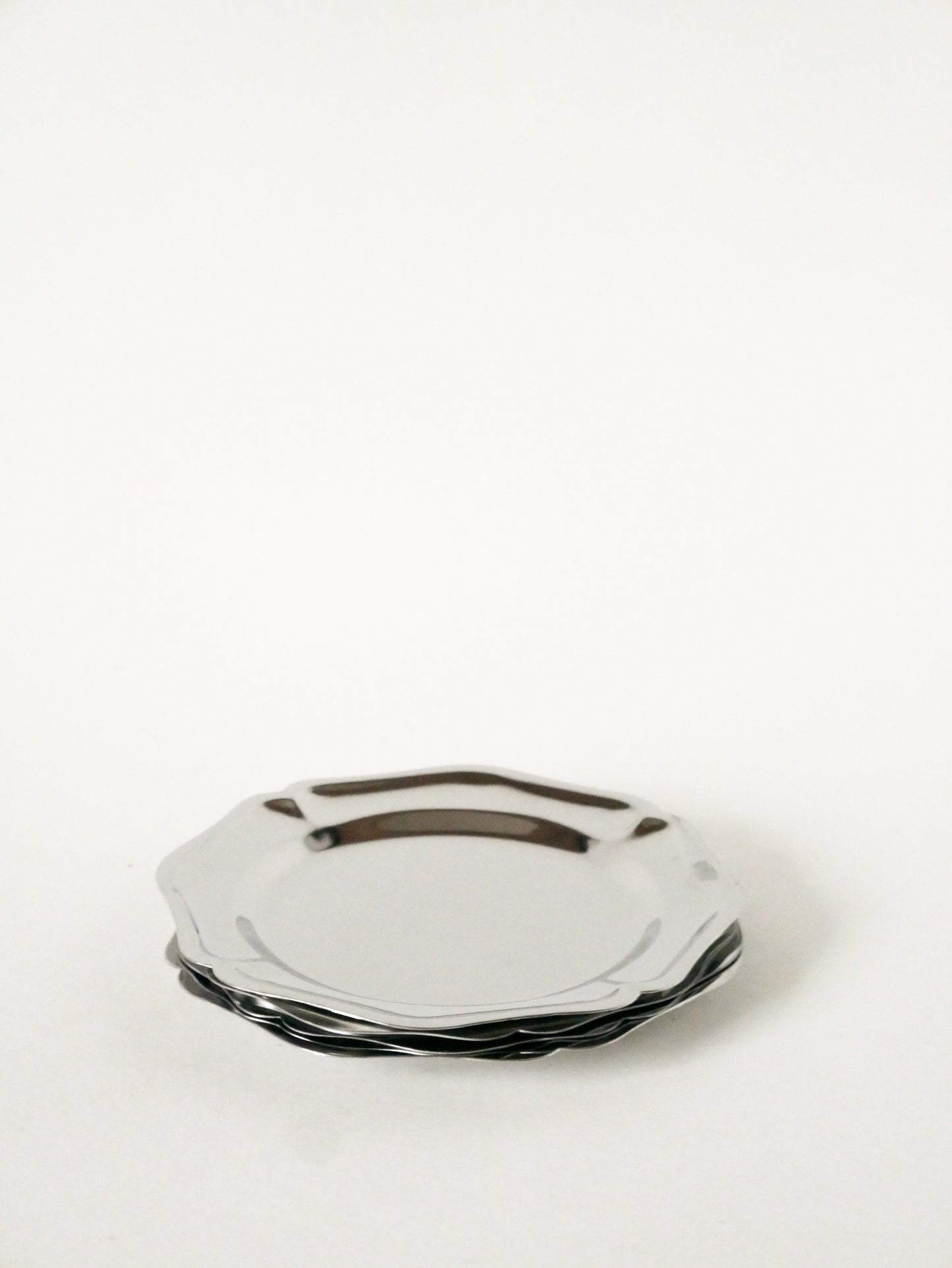 Ensemble de 4 dessous de bouteilles dentelés en inox, Design, 1970