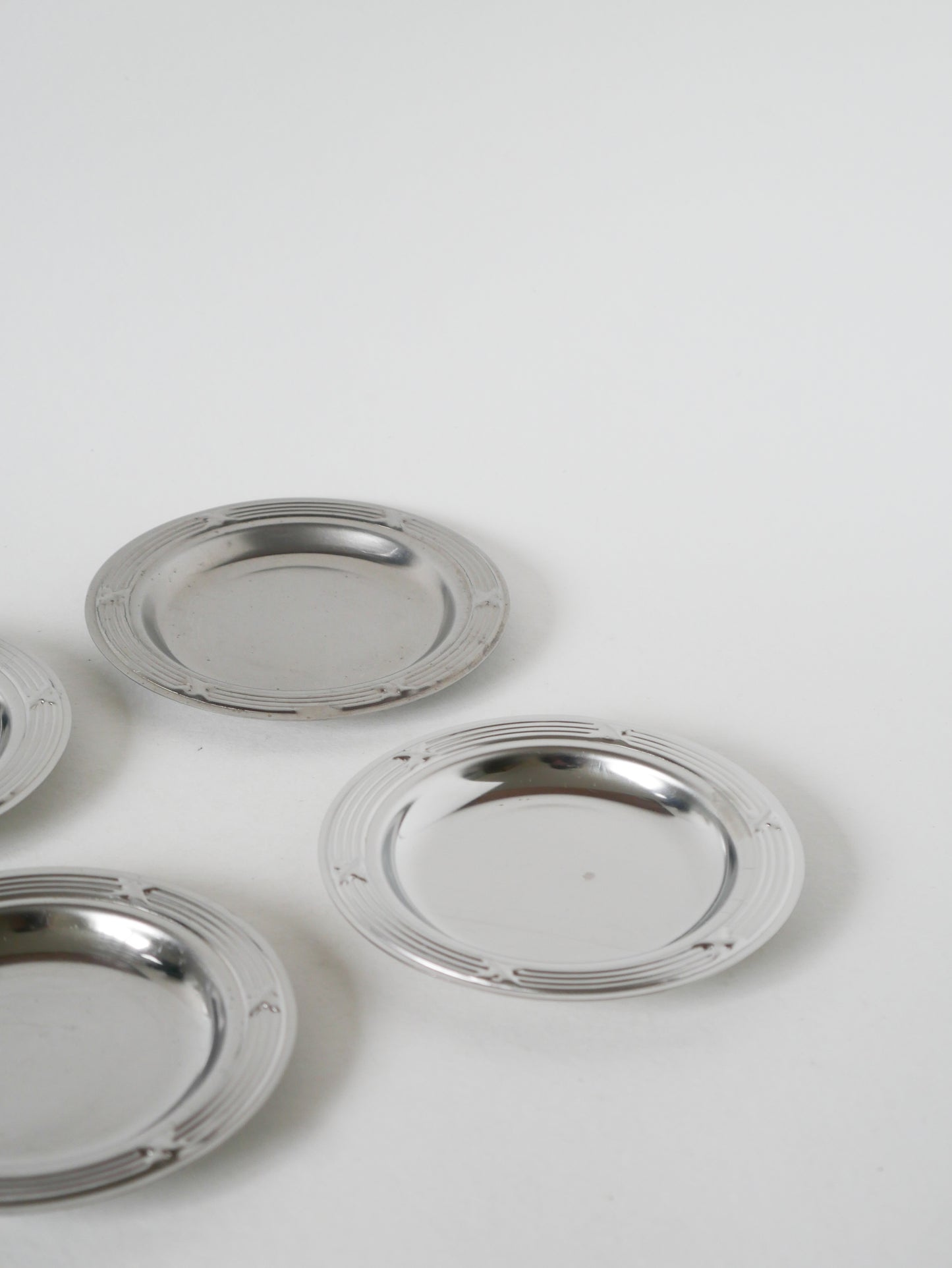 Lot de 4 dessous de verres en inox, Design, 1970 - 11.5 cm