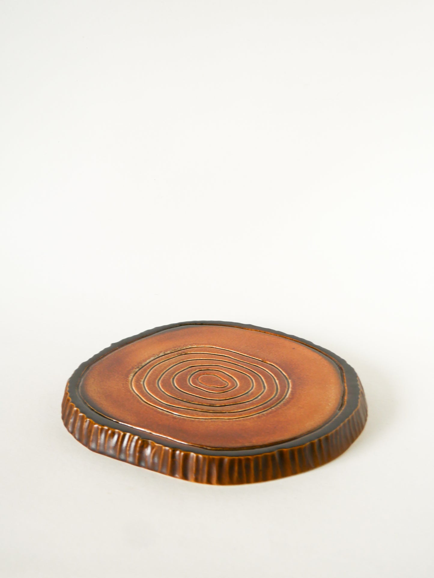 Dessous de plat en barbotine, forme Tronc, Poterie du Périgord, 1970