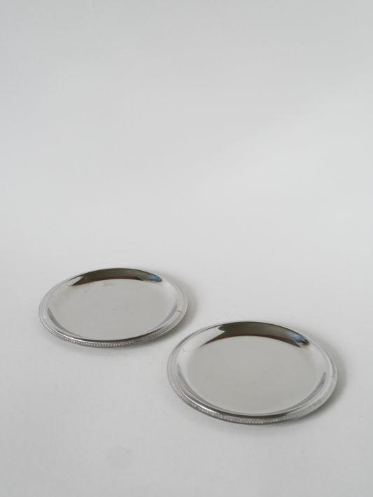 Paire de dessous de bouteilles en inox, 1970 - 14 cm