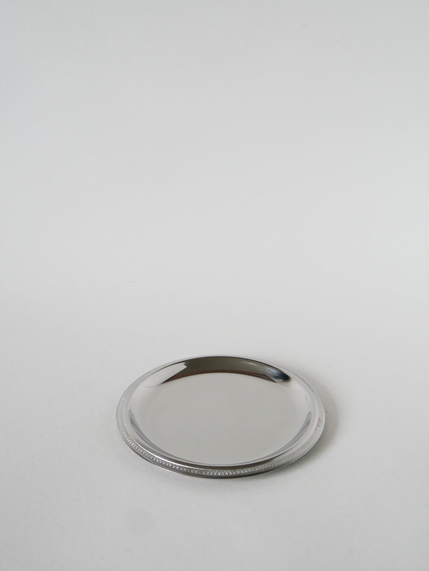 Paire de dessous de bouteilles en inox, 1970 - 14 cm