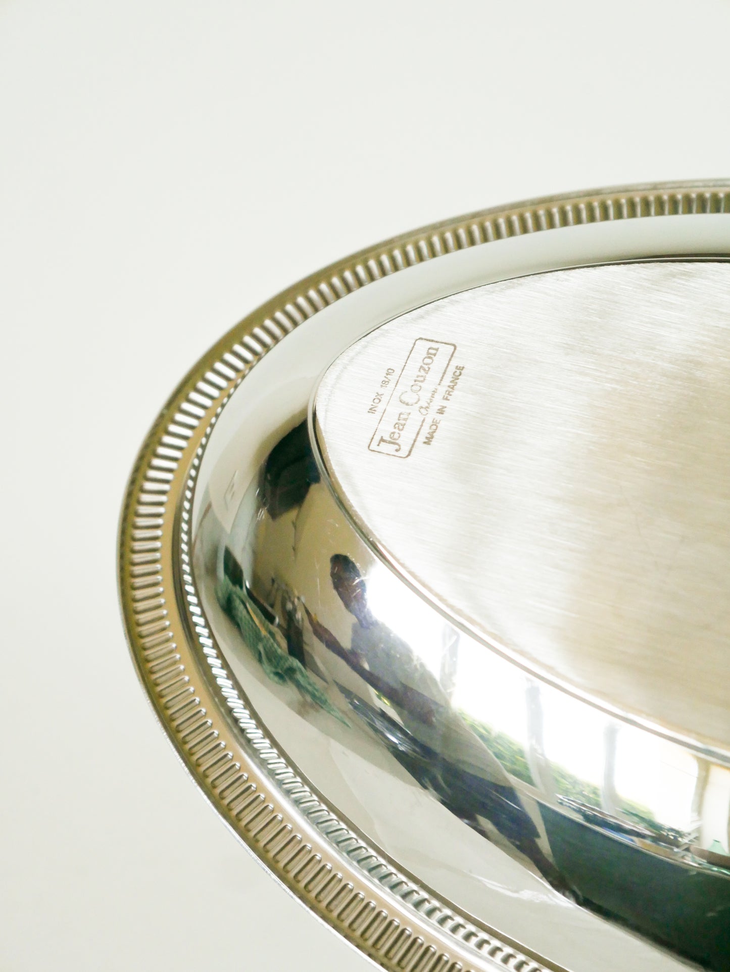 Grand plat oval en inox, signé Jean Couzon, 1970